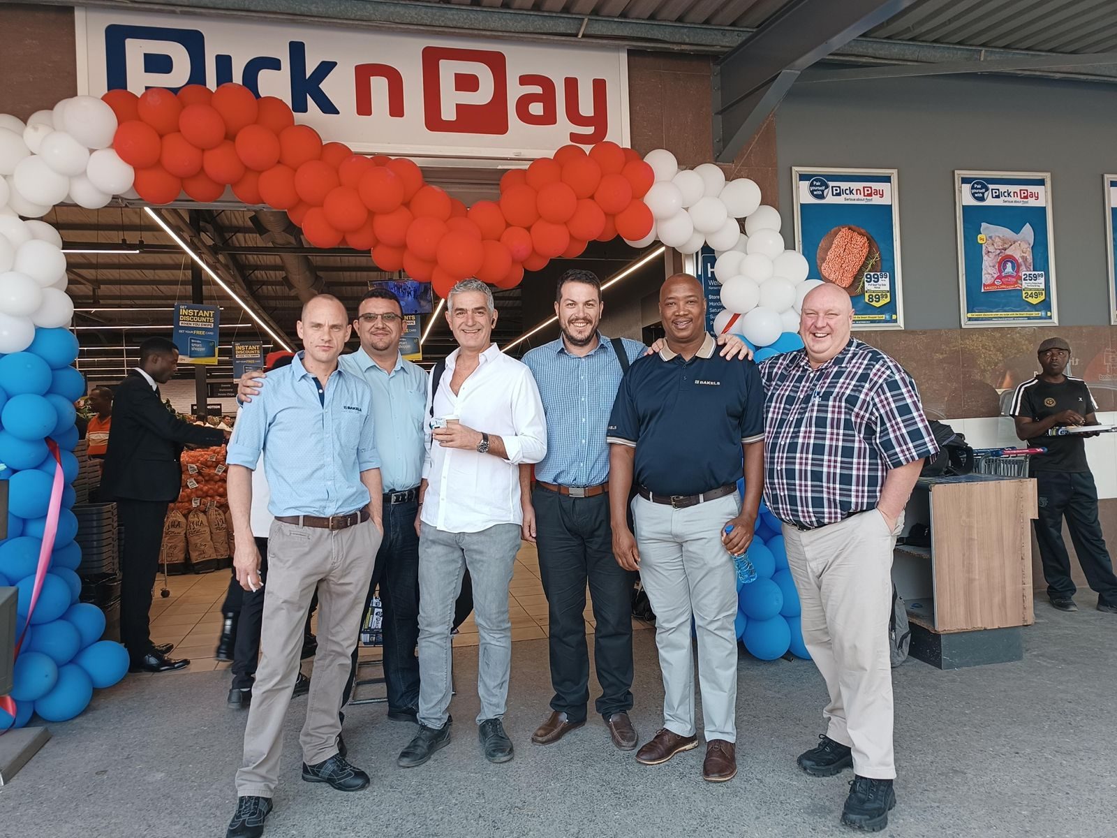MRX with partners at a retail opening in Zambia