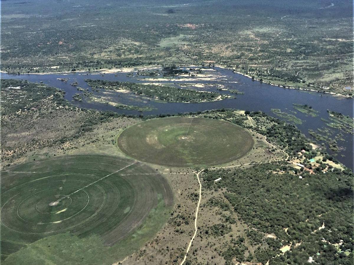 Centre-pivot irrigation circles beside the Zambezi River in Zambia